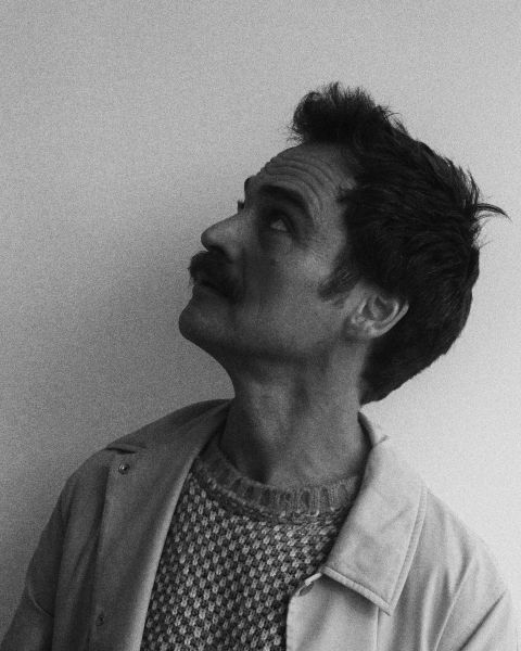 Reuben Sutherland headshot looking up.jpg